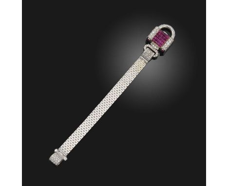 A ruby and diamond watch, mid 20th century, of padlock design, set with circular-cut diamonds, the central panel of calibré-c