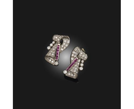 A pair of ruby and diamond earrings, 1940s and later, of abstract scrolled design, pavé-set with circular- and single-cut dia