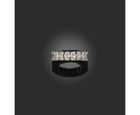 A diamond eternity ring, set with a continuous band of oval diamonds totalling approximately 3.80 carats, mounted in platinum
