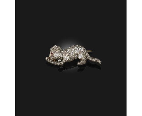 A diamond brooch, late 19th century, depicting a kitten about to pounce, pavé-set with circular- and rose-cut diamonds, its e