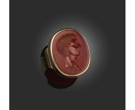 A carnelian intaglio ring, early 19th century and later, collet-set with a carnelian intaglio of Antinous, in a later plain g