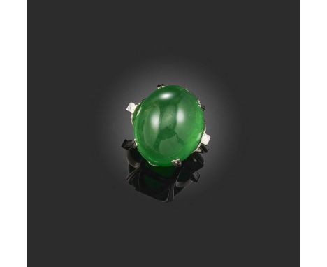 A jadeite cabochon ring, claw-set with diamond shoulders in plain platinum ring, size M A verbal from GCS stating that the Ca