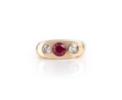 A synthetic ruby and diamond three stone ring, the circular-cut synthetic ruby flanked with circular-cut diamonds in yellow g