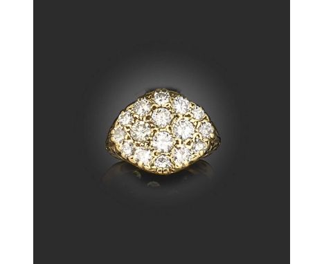 A diamond-set gold plaque ring, of lozenge design set with round brilliant-cut diamonds in carved yellow gold setting, size K