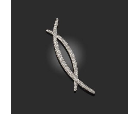 A diamond brooch, of abstract design, pave-set with circular-cut diamonds in white gold, stamped 18K, length 6.7cm
