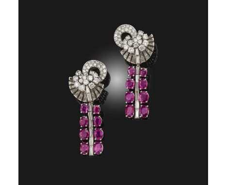 A pair of ruby and diamond earrings, mid 20th century, of 'day and night' design, composed of a scrolled earring set with bri