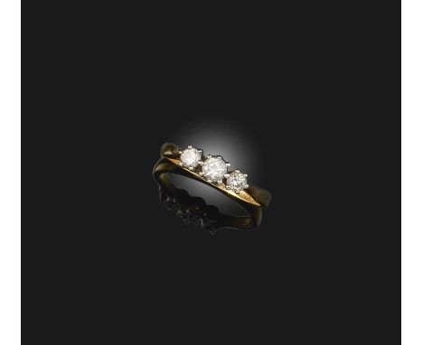 A three-stone diamond ring, claw-set with three brilliant-cut diamonds totalling approximately 0.35 carats, mounted in 18ct g