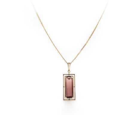A pink tourmaline pendant necklace, set with a step-cut pink tourmaline weighing approximately 17.00 carats, within a frame o