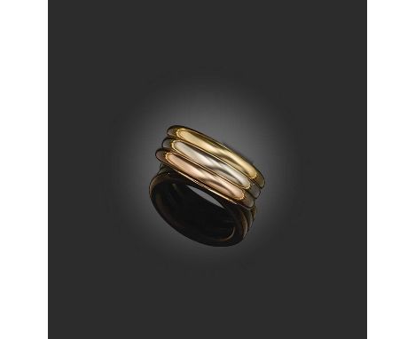 Cartier, a gold ring, 'Trinity de Cartier', 1990s, composed of three gold bands with a tricoloured finish, size M, signed Car