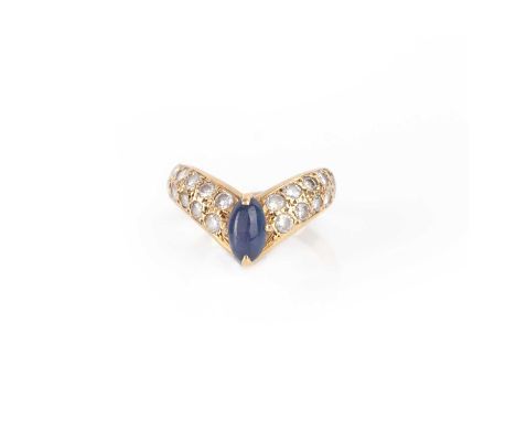 A star sapphire and diamond ring, of wishbone design, set with a cabochon star sapphire, to a band pavé-set with brilliant-cu