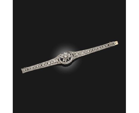 A diamond bracelet, late 19th century composite, centring on a flower enclosed by a crescent moon, to an articulated bracelet