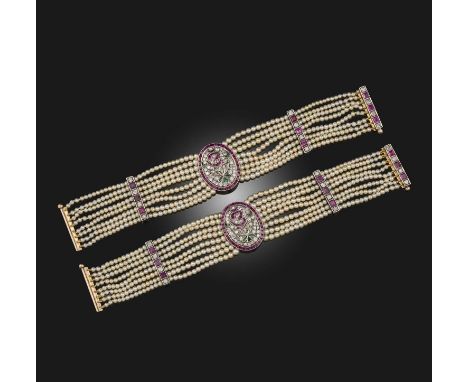 A pair of natural pearl, ruby and diamond bracelets, the eight row bracelet centring on a ruby and diamond plaque with emeral