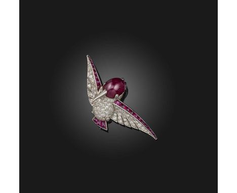 An Art Deco ruby and diamond kingfisher brooch, the stylised bird with a cabochon ruby head and diamond eyes, the body pave-s