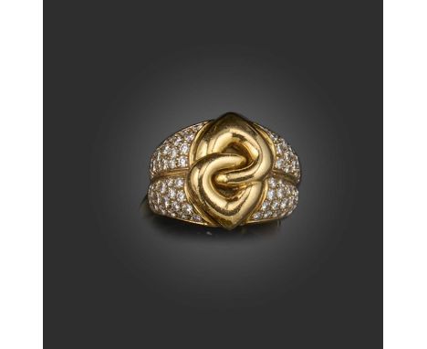 Bulgari, a gold and diamond ring, 'Doppio Cuore', centring on two interlocking heart motifs in polished gold, to a wide band 