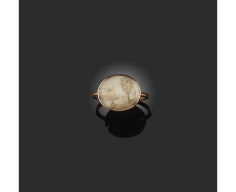 λ An unusual Georgian ivory and hairwork ring, late 18th/early 19th century, of oval outline, the glazed setting containing a