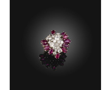 A ruby and diamond cluster ring, set with marquise-shaped rubies and graduated circular-cut diamonds in platinum, size M