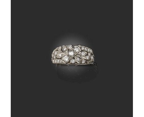 A diamond half hoop ring, set with graduated circular-cut diamonds in foliate design, set in white gold, size K 1/2