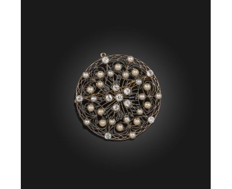A pearl and diamond brooch/pendant, early 20th century, of circular outline, with a radiating design in openwork knife wire, 