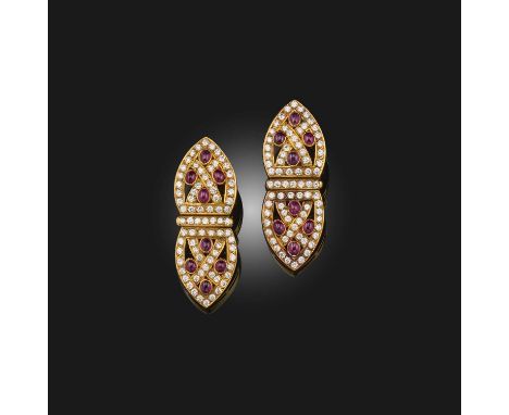Costas Kessaris, a pair of ruby and diamond ear clips, of waisted lozenge design set with circular-cut diamonds and cabochon 