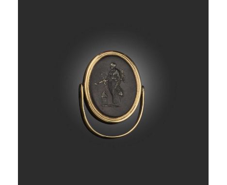 No reserve: a glass intaglio ring, early 19th century, set with an oval glass intaglio depicting the goddess Hygeia, in a gol