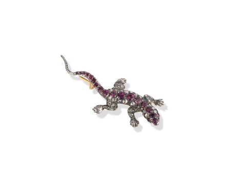 A ruby and diamond-set lizard brooch, pave-set with rubies and diamonds in silver and gold, length 5.7cm