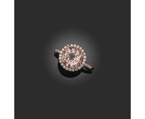 A morganite and diamond ring, of cluster design, set with a circular-cut morganite, to a border and shoulders set with brilli