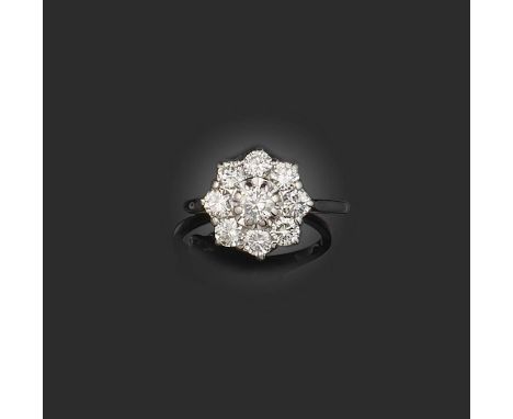 A diamond cluster ring, set with nine round brilliant-cut diamonds in white gold, size O
