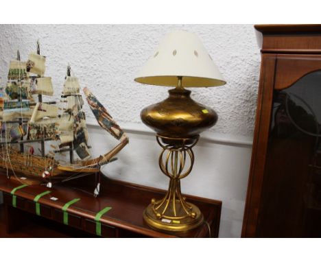 Gilt coloured designer lamp and shade