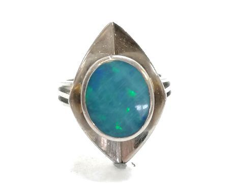 Mid 20th C unmarked white gold (tested as 18ct) stylish opal ring - size O½ &amp; 9g total weight Condition reportReflecting 