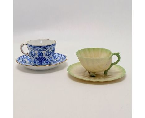 Belleek green Neptune cup and saucer in the form of a shell T/W a Royal Crown Derby cup and saucer Condition reportboth in go