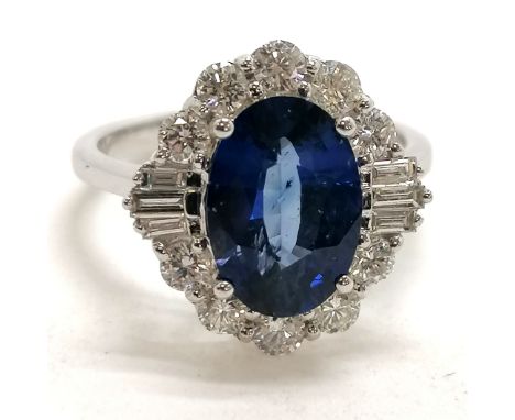 18ct marked white gold sapphire (approx 2.5cts) &amp; diamond (16 - 10 brilliant cut &amp; 6 baguette) cluster ring - size N½