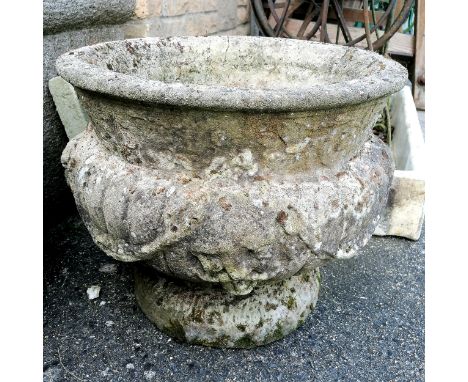 Large concrete planter with 2 faces 49cm diameter x 40cm high Condition reporthas 2 cracks running from the rim