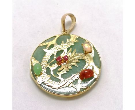 14ct hallmarked gold pendant with a jade panel &amp; dragon decoration to front set with gemstones - 2.5cm diameter &amp; tot