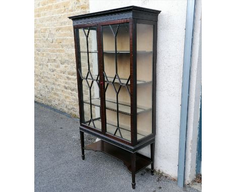 Edwardian 2 door mahogany glazed cabinet with blind carved Chippendale style frieze. 179cm high x 100cm wide x 42cm deep Cond