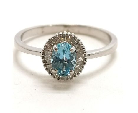 18ct hallmarked white gold Iliana ring set with aquamarine circled by baguette diamonds - size V½ &amp; 4.2g total weight 