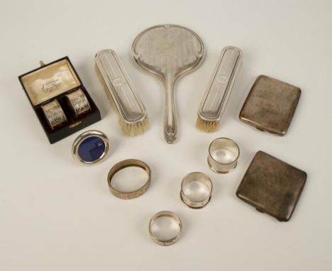 A PAIR OF NAPKIN RINGS in a case, by James Deakin & Sons, Chester 1900, a small photograph frame, three further napkin rings,