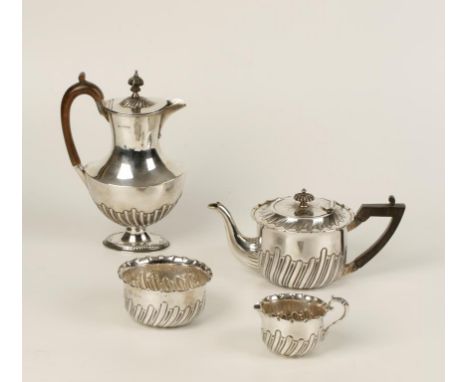 A VICTORIAN THREE PIECE TEA SET of circular form with part fluted decoration, by Lee & Wigfull, Sheffield 1894/5/7, the teapo