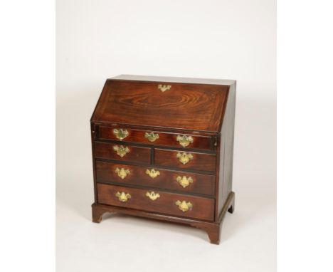A GEORGE III MAHOGANY BUREAU, the sloping fall enclosing a fitted interior with central cupboard flanked by quarter column fr