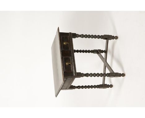 A CHARLES II OAK SIDE TABLE, the rectangular top with moulded border above a single frieze drawer with two panel front, on bo