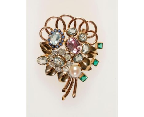 A GEMSTONE CLUSTER BROOCH mounted in unmarked yellow gold as a bouquet of flowers and collet-set with clusters of graduated r