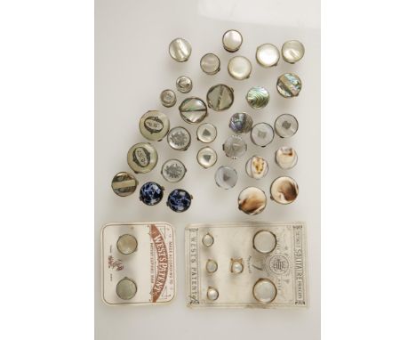A COLLECTION OF MOTHER OF PEARL PAUA SHELL AND SHELL BUTTONS mounted in yellow and white metal (a lot)