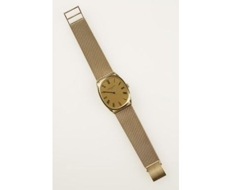 PATEK PHILLIPE: A GENTLEMAN'S 9CT YELLOW GOLD WRISTWATCH, the oval gilt dial with Roman numerals, inscribed "Patek Phillipe, 