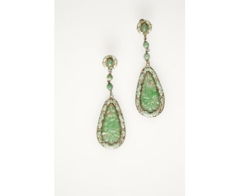 A PAIR OF JADE AND ENAMEL DROP EARRINGS, each set with a pear-shaped pierced jade panel, carved with flowers and leaves, with
