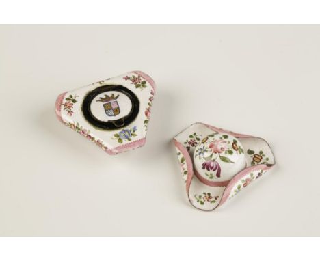 A PAIR OF ENAMEL PATCH BOXES, in the form of tricorn hats, with floral decoration on white ground, one hat with a hinged lid 
