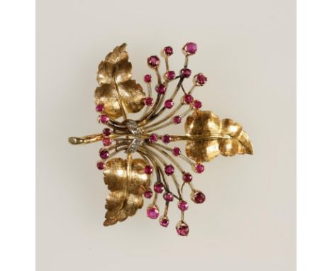 A RUBY AND DIAMOND LEAF AND FLOWER SPRAY BROOCH, the three 18ct yellow gold textured leaves with multiple knife-edge fans, ea