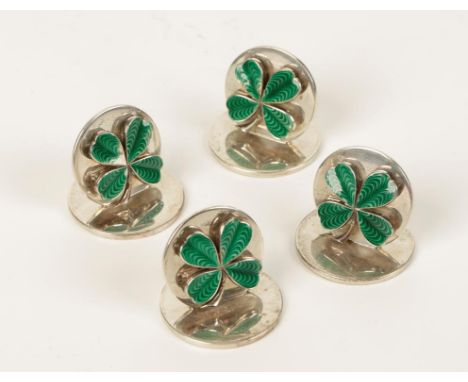 A SET OF FOUR MENU CARD HOLDERS of circular form, applied with four leaf clovers, decorated in green guilloche enamel, on cir