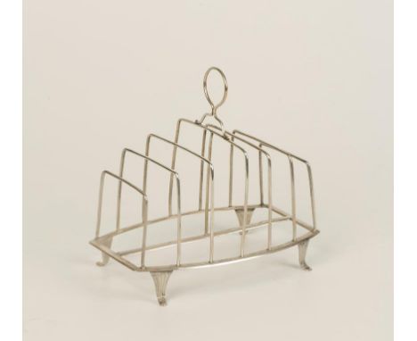 A GEORGE III TOASTRACK of seven bar wire-work form with loop carrying handle, on bracket feet, by Godbehere, Wigan and Boult,