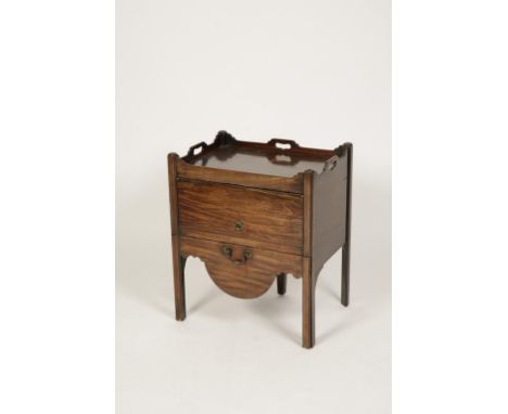 A GEORGE III MAHOGANY TRAY-TOP COMMODE, the rectangular top with raised border with pierced handles above a rising front and 