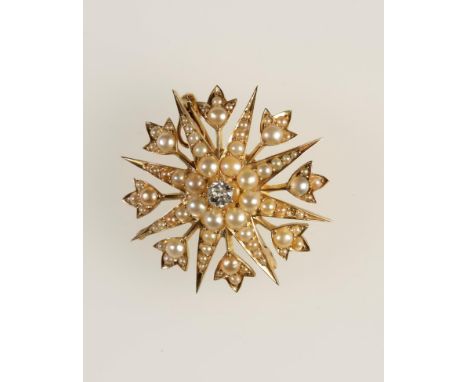 A VICTORIAN SEED PEARL AND DIAMOND BROOCH PENDANT claw-set to the centre with a round old-cut diamond, c.0.15cts and surround