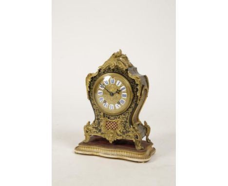 A FRENCH BOULLE AND ORMOLU MANTLE CLOCK with a circular ormolu dial with inset blue and white enamel hours, with a two-train 